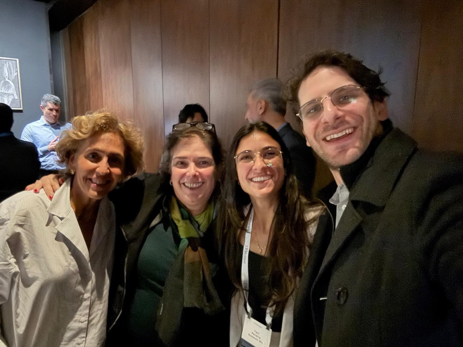 Members taking a selfie at a dinner